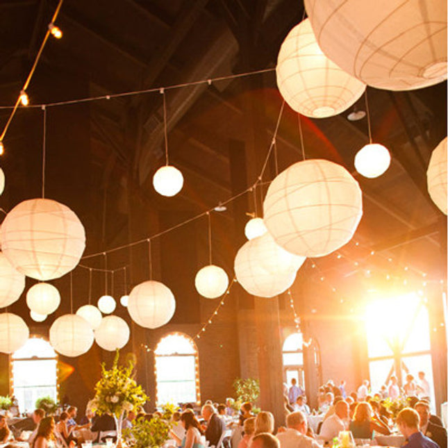 Paper Lanterns hanging in a barn.