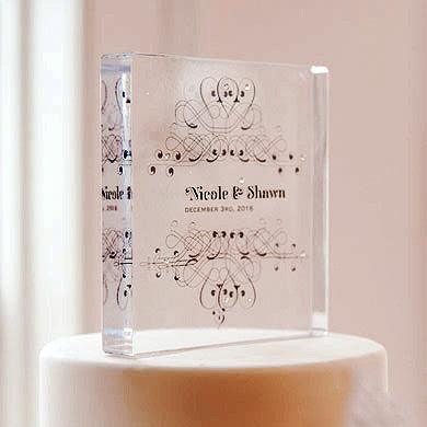 Clear Acrylic Block Cake Topper with the bride and groom's name and the wedding date.