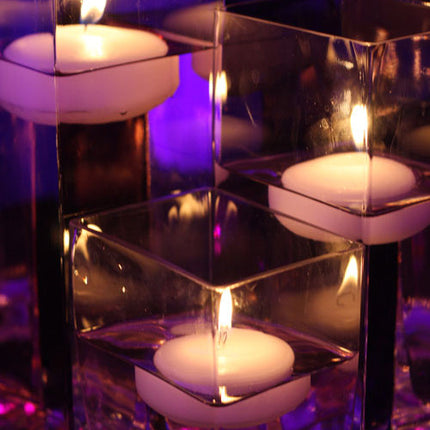 The glowing light of the  floating candle, shown as a centerpiece. (other items sold separately)