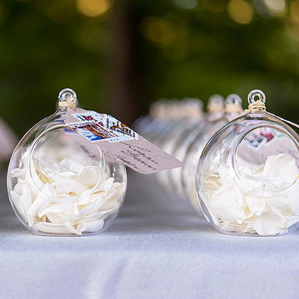 Blown Glass Globe filled with White flowers petals.