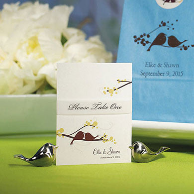 Two Love Bird Card Holders holding a place card.