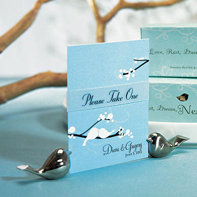 A set of Love Bird Card Holders holding a place card.